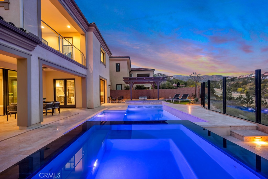 20120 Jubilee Way Porter Ranch, CA 91326 - Photo 55 of 55 a swimming pool with outdoor seating and yard