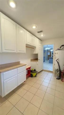 a kitchen with a sink and cabinets