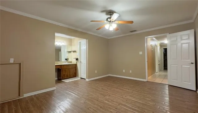 wooden floor in an empty room with a mirror