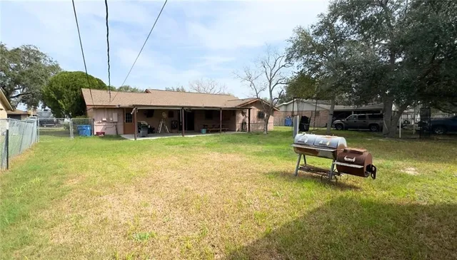 a swimming pool with outdoor seating and yard