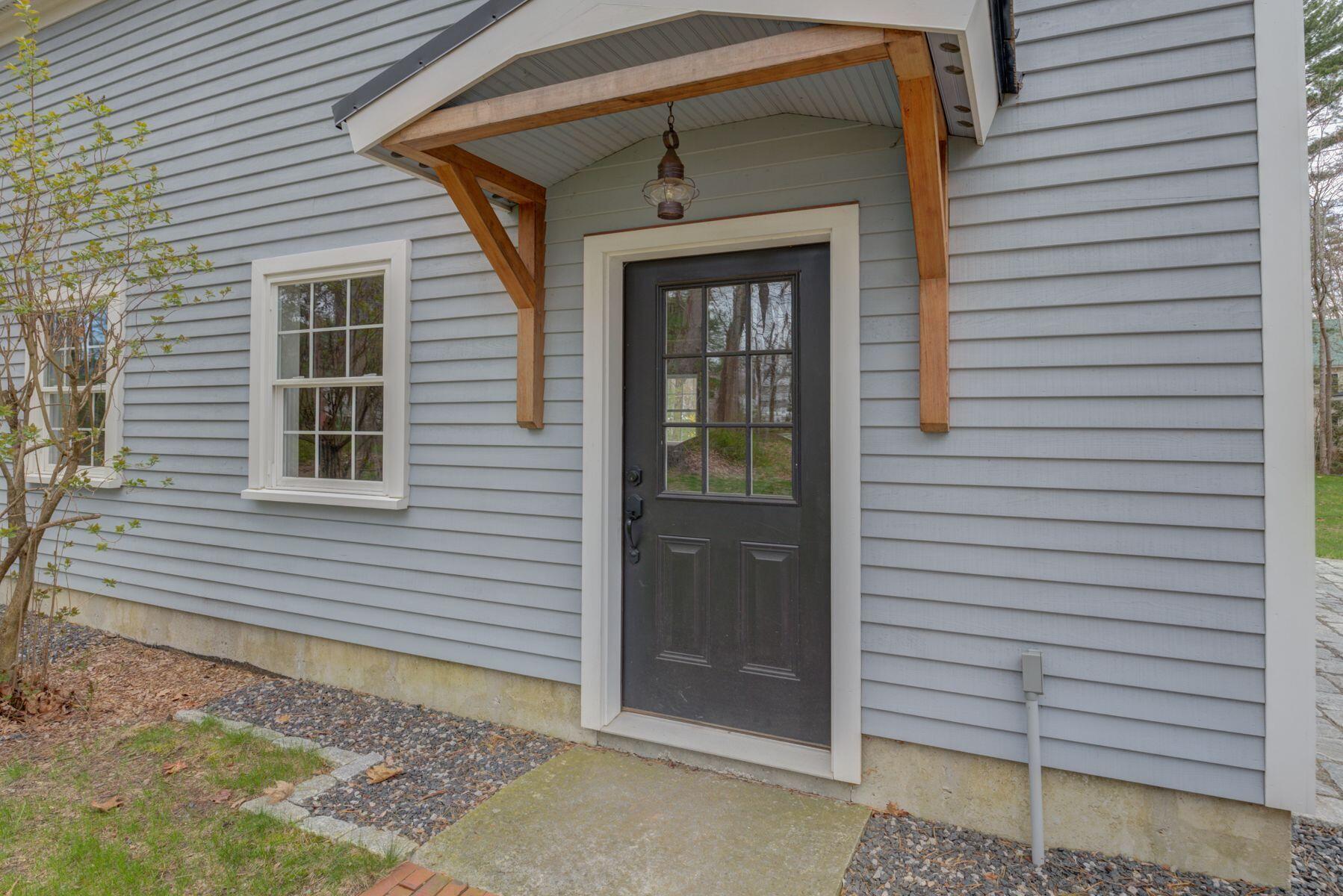44 Hardy's Bluff Wells Wells, ME 04090 - Photo 25 of 30 Side entrance to garage.