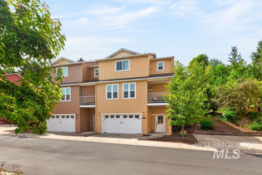 1337 Bristol Road Moscow, ID 83843 - Photo 27 of 28 Multi-level townhome featuring a two-car garage, multiple balconies, and a neutral-toned facade