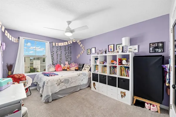 a bedroom with furniture and window
