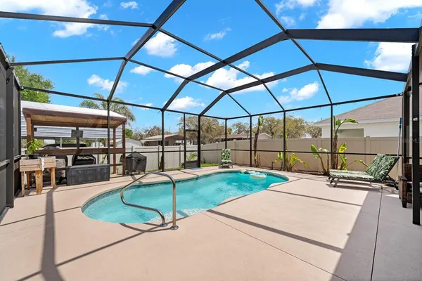 a patio with a table and chairs