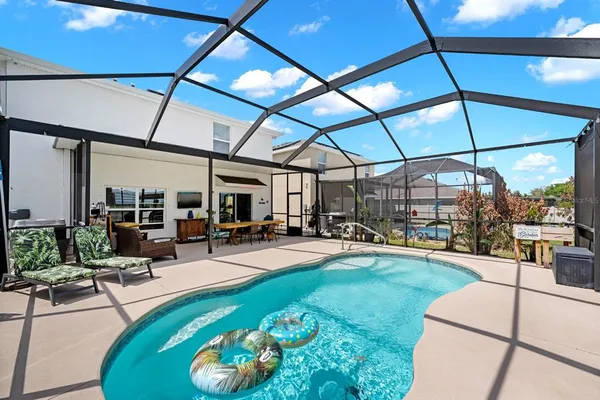 a view of a swimming pool with a patio