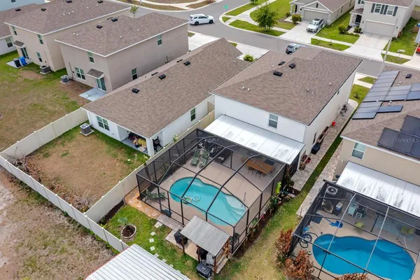 an aerial view of a house with a garden