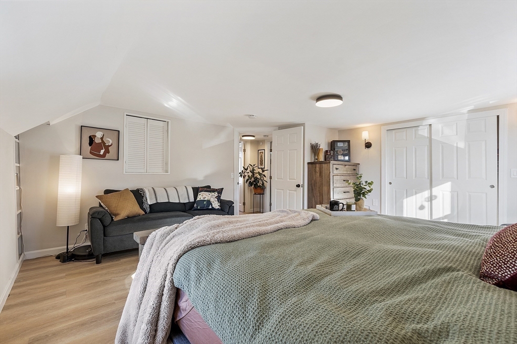 8 Bacon Street Oxford, MA 01540 - Photo 21 of 38 a spacious bedroom with a bed and a large mirror