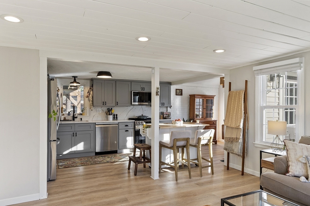 8 Bacon Street Oxford, MA 01540 - Photo 8 of 38 a view of a dining room with furniture window and wooden floor
