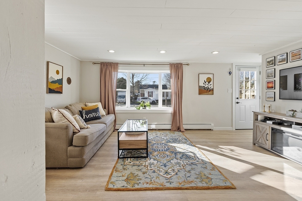 8 Bacon Street Oxford, MA 01540 - Photo 10 of 38 a living room with furniture and a rug