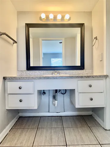 a bathroom with a toilet a sink and bathtub