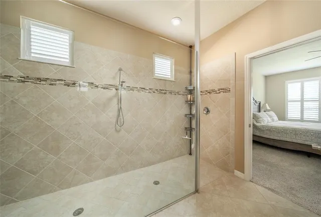 a bathroom with a tub and a shower