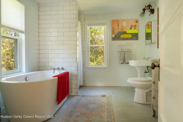 a bathroom with a bathtub and sink