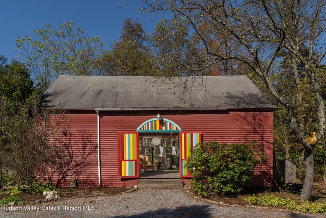 a view of a brick house with large windows