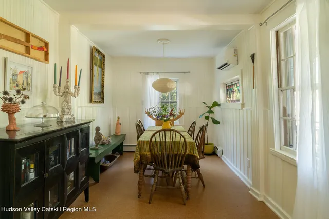 a view of a livingroom with furniture window and bathroom