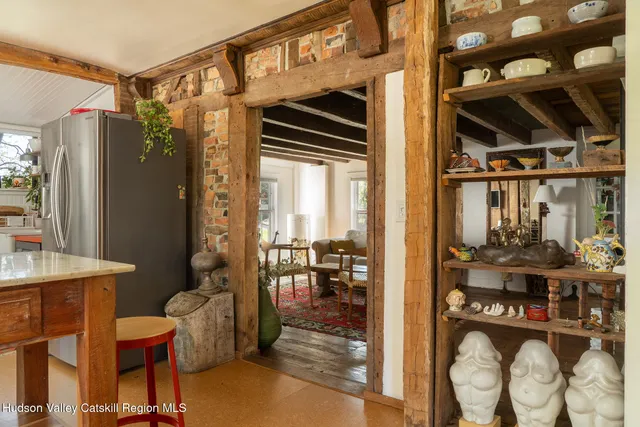 a dining room with furniture and a chandelier