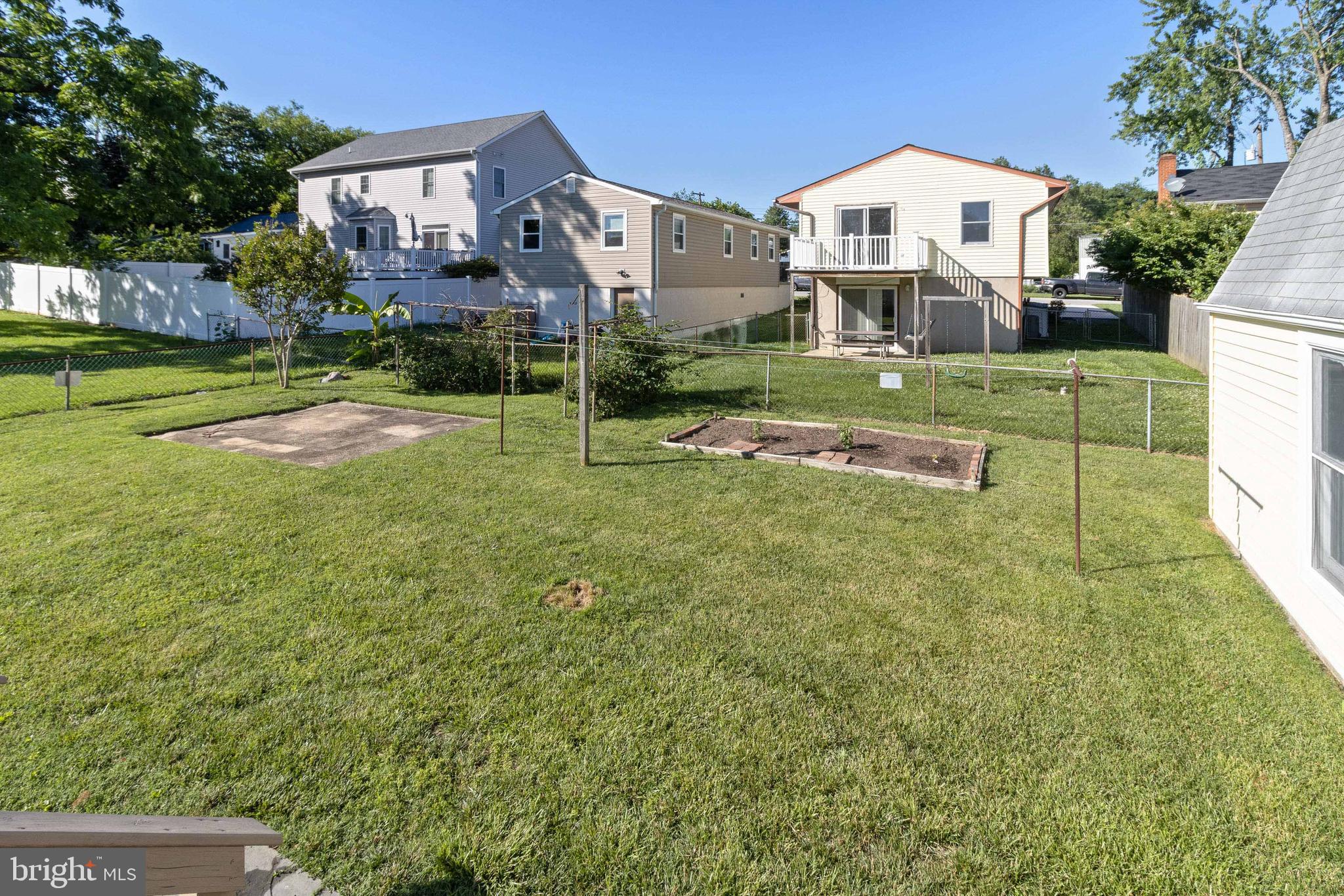 1631 Arundel Road Edgewater, MD 21037 - Photo 40 of 46 Rear Yard with vegetable garden and Concrete Patio