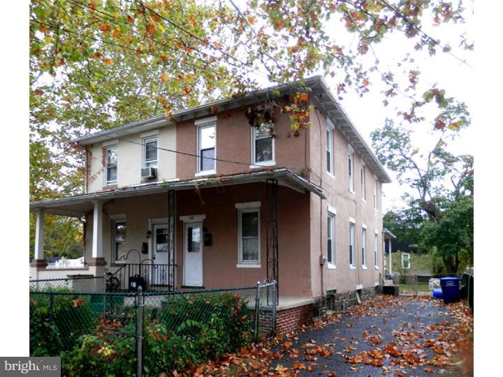122 West Washington Street Riverside, NJ 08075 - Photo 1 of 1 a front view of a house with garden