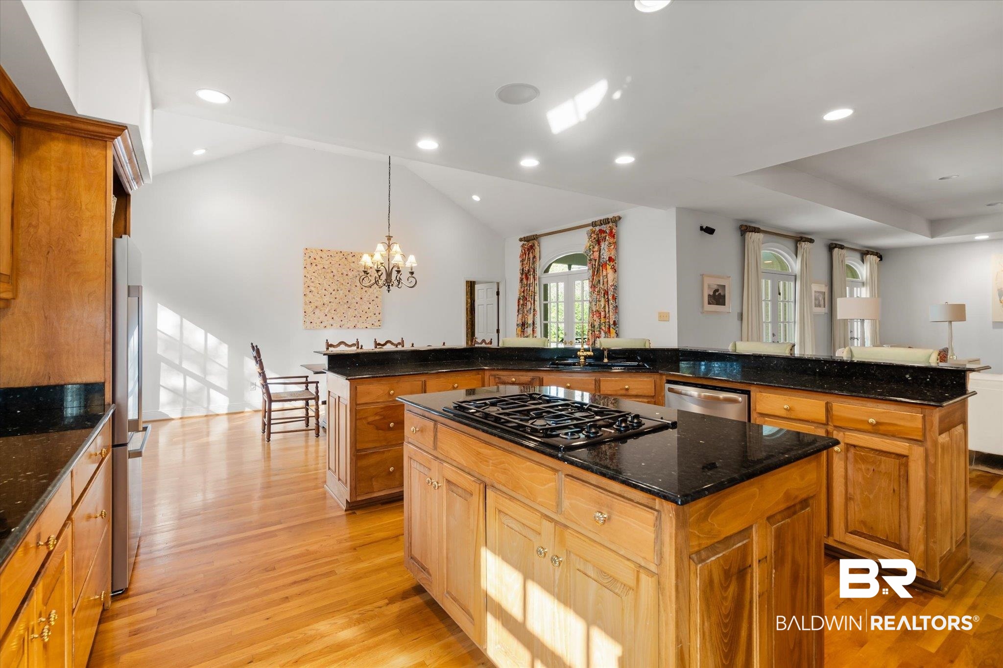 143 Myrtlewood Lane Mobile, AL 36608 - Photo 11 of 55 Kitchen featuring a notable chandelier, light wood-type flooring, appliances with stainless steel finishes, and a kitchen island