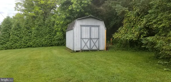 a wooden door in front of a house