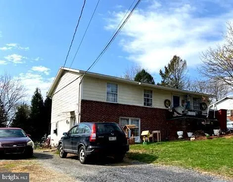 a view of a car parked in front of a house