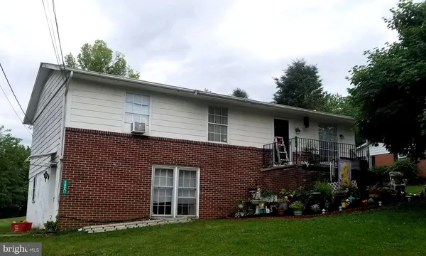 a view of house with yard