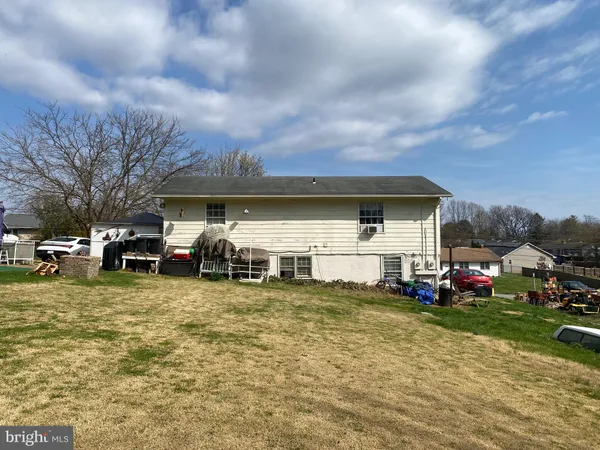 a view of a house with a back yard