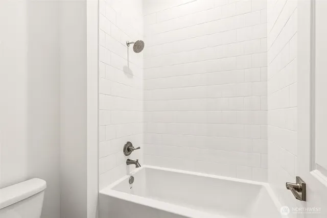 a kitchen with a sink cabinets and wooden floor