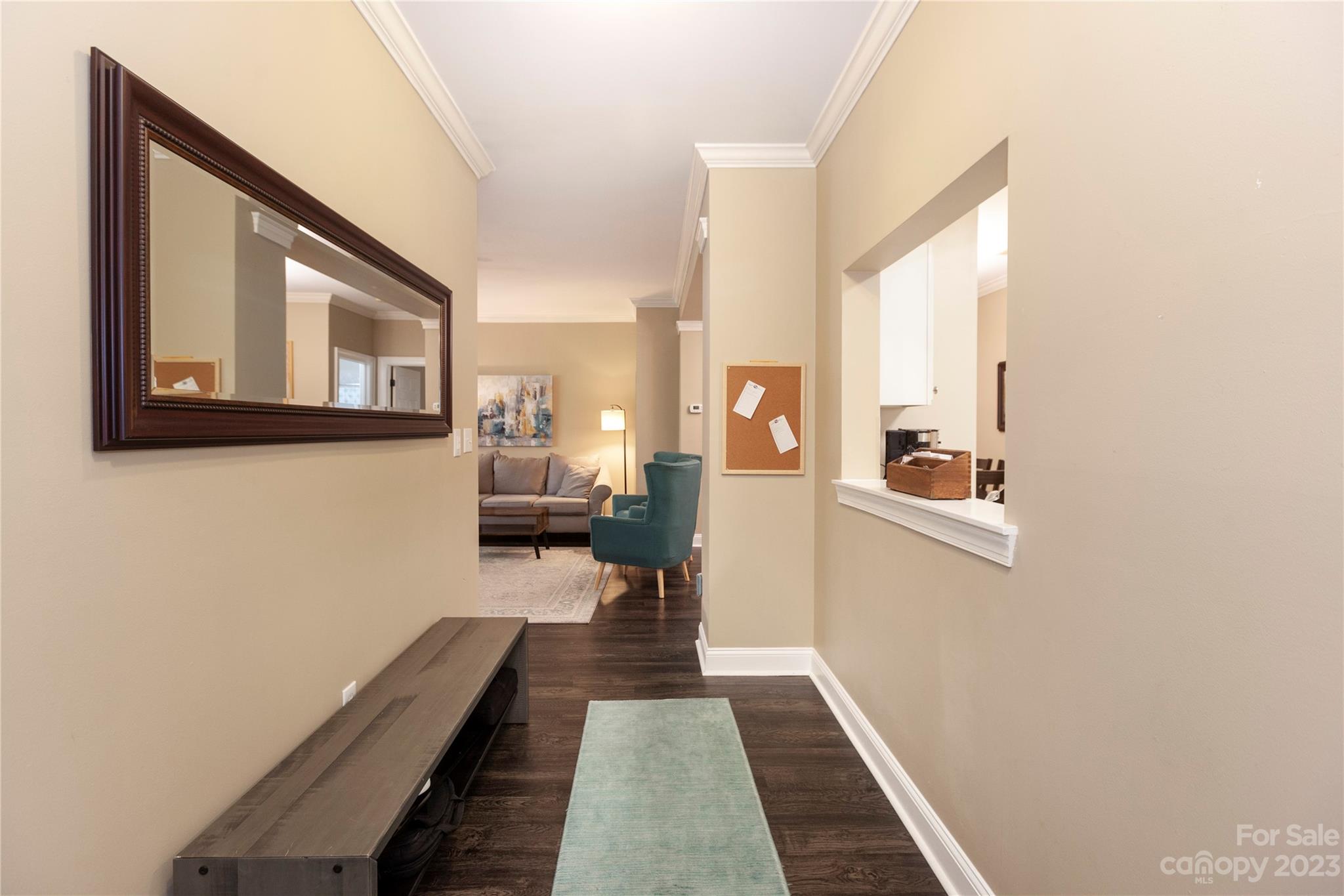5601 Fairview Road, Unit 19 Charlotte, NC 28209 - Photo 13 of 30 a hallway with a large window and couch