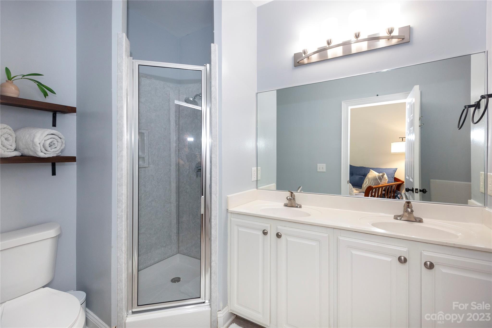 5601 Fairview Road, Unit 19 Charlotte, NC 28209 - Photo 17 of 30 a bathroom with a sink toilet and shower