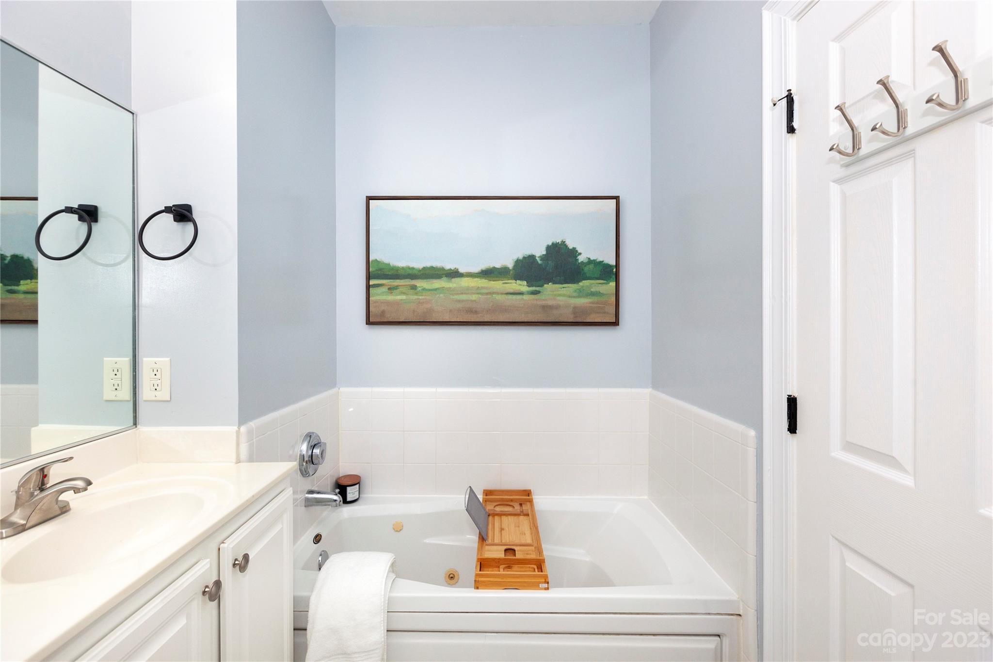 5601 Fairview Road, Unit 19 Charlotte, NC 28209 - Photo 18 of 30 a bathroom with a tub and sink