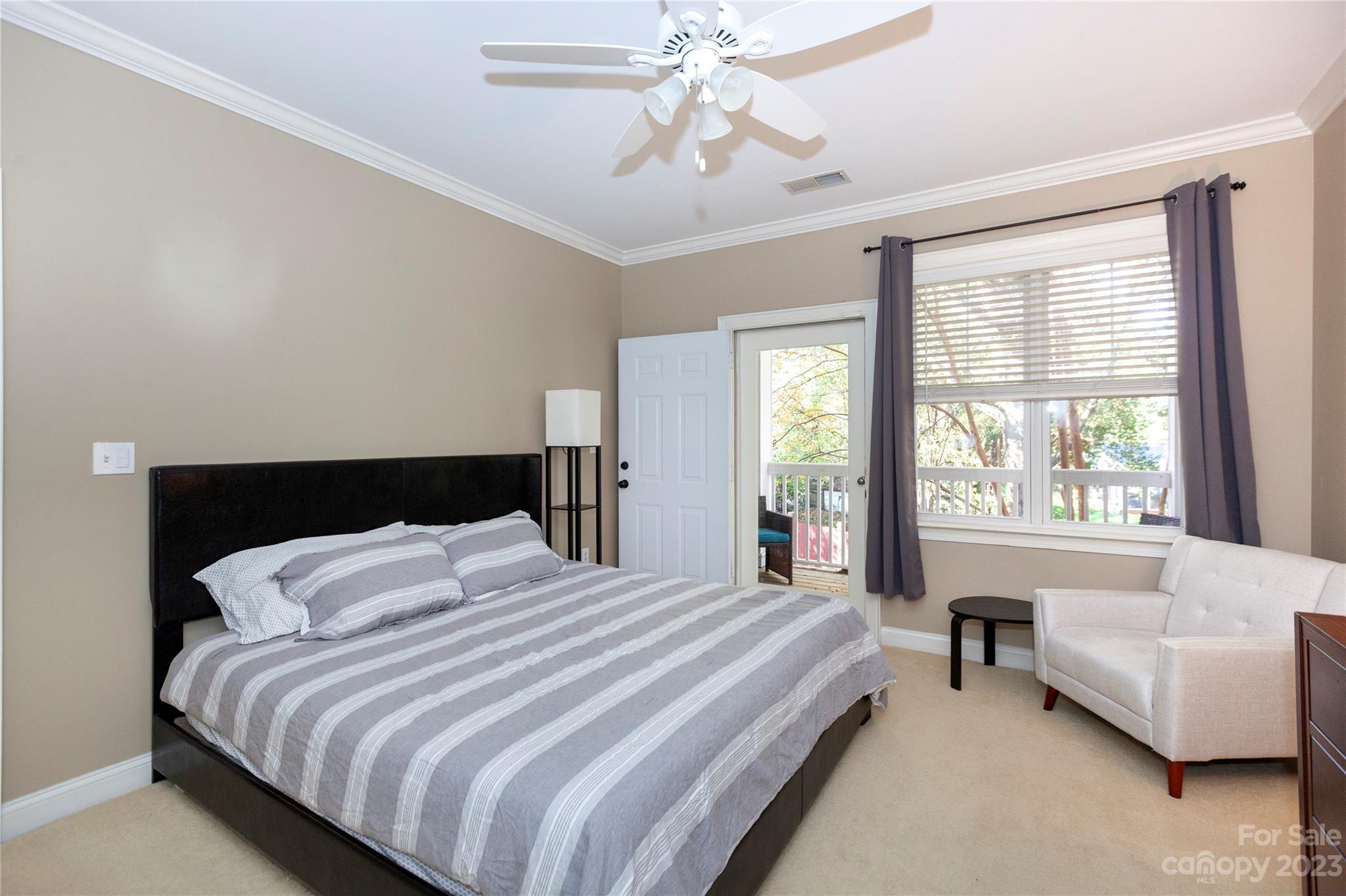 5601 Fairview Road, Unit 19 Charlotte, NC 28209 - Photo 20 of 30 a bedroom with bed and a large window