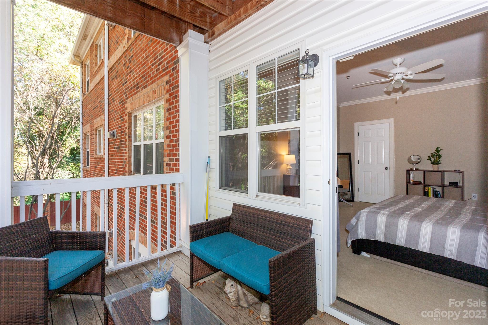 5601 Fairview Road, Unit 19 Charlotte, NC 28209 - Photo 23 of 30 a bedroom with a bed and wooden floor