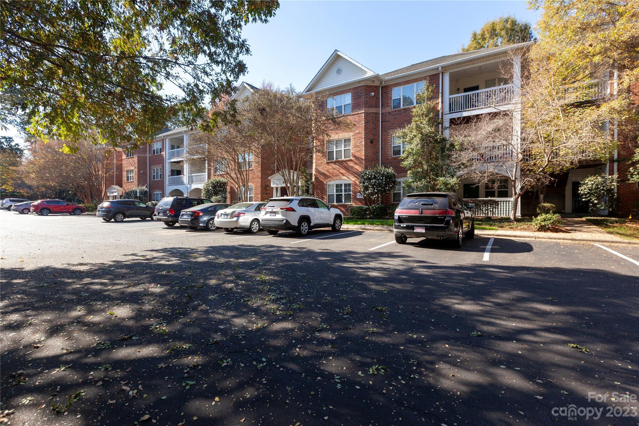 5601 Fairview Road, Unit 19 Charlotte, NC 28209 - Photo 26 of 30 a view of road with card parked on side and retail shops