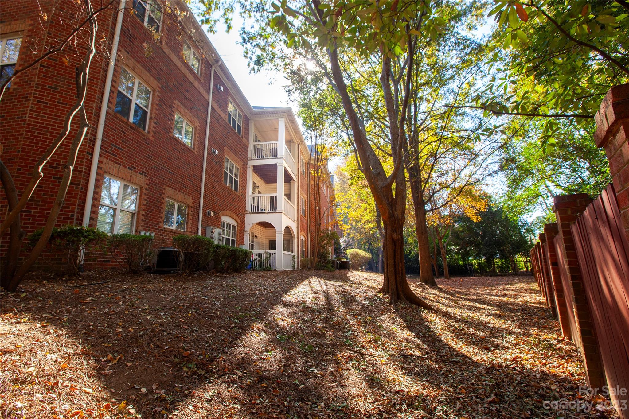 5601 Fairview Road, Unit 19 Charlotte, NC 28209 - Photo 30 of 30 a view of a building with a yard