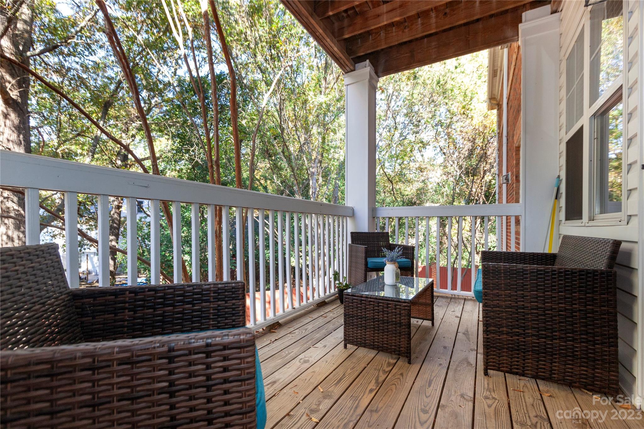 5601 Fairview Road, Unit 19 Charlotte, NC 28209 - Photo 6 of 30 a balcony with wooden floor