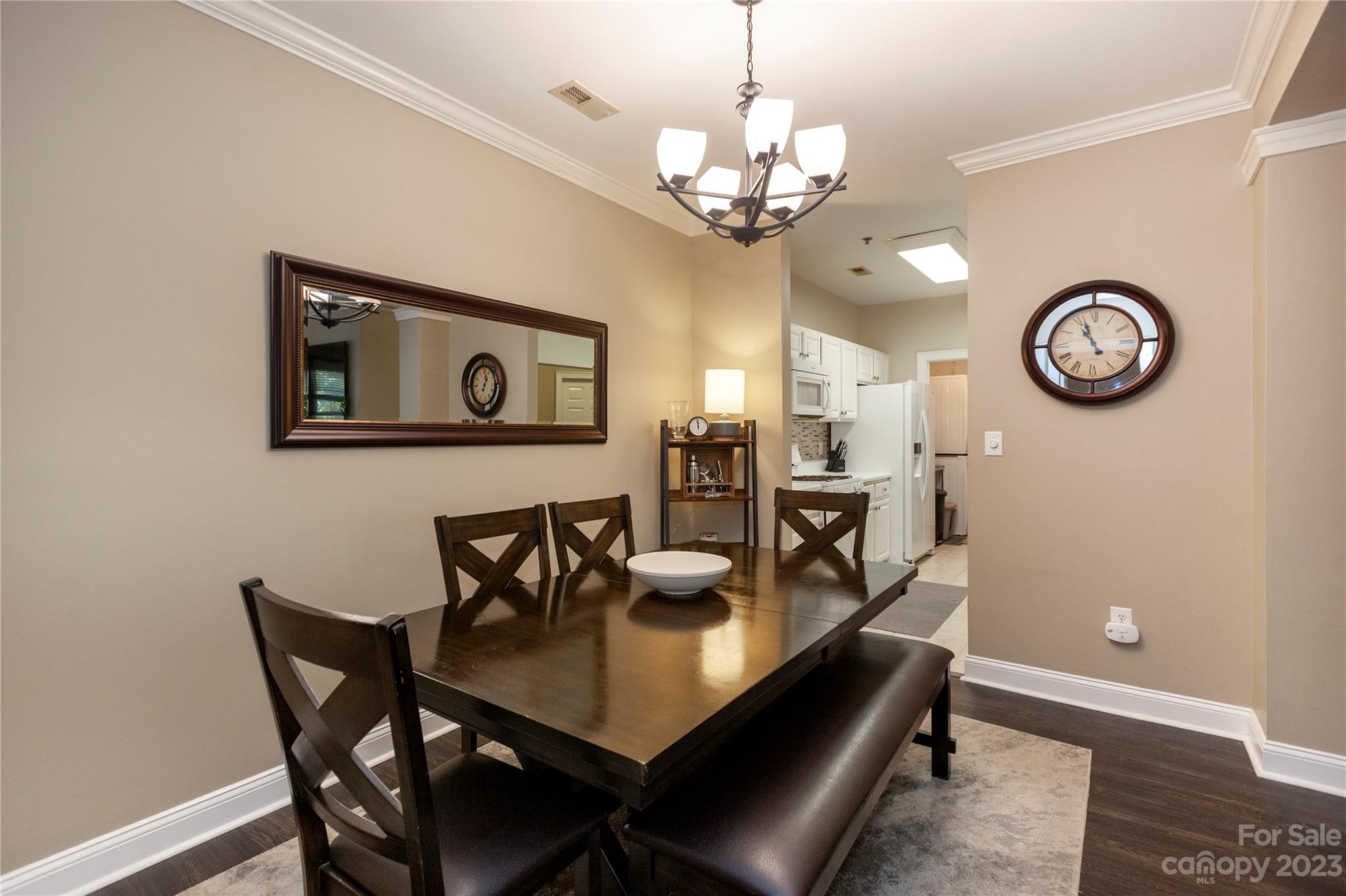5601 Fairview Road, Unit 19 Charlotte, NC 28209 - Photo 8 of 30 a view of a dining room with furniture and a chandelier