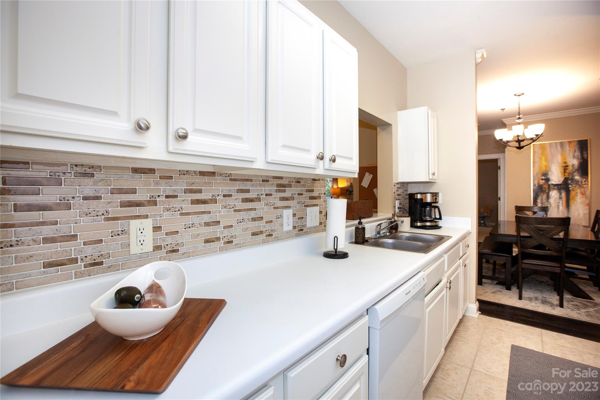 5601 Fairview Road, Unit 19 Charlotte, NC 28209 - Photo 9 of 30 a kitchen with a sink and a stove