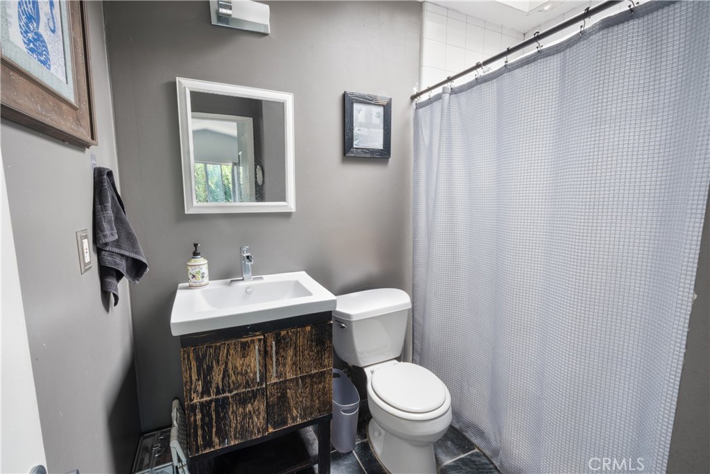 11840 Rustic Place Fontana, CA 92337 - Photo 12 of 20 a bathroom with a sink and a toilet
