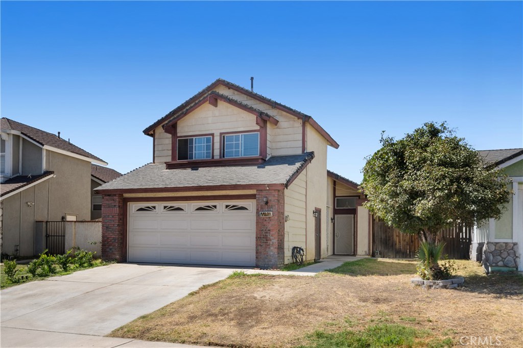 11840 Rustic Place Fontana, CA 92337 - Photo 16 of 20 a front view of a house with a yard