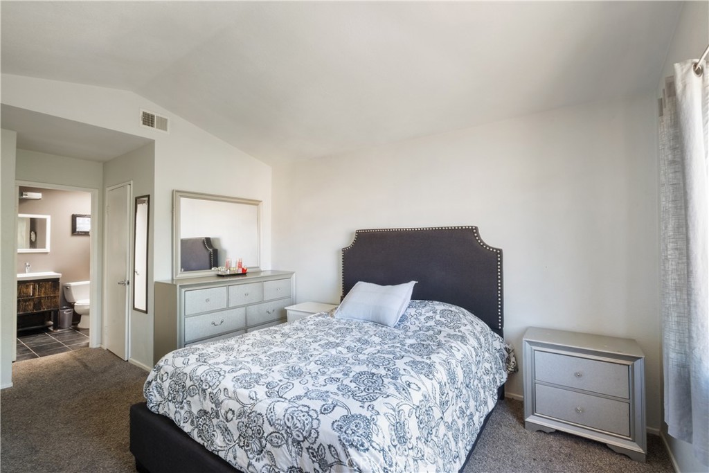 11840 Rustic Place Fontana, CA 92337 - Photo 9 of 20 a bedroom with a bed and dresser