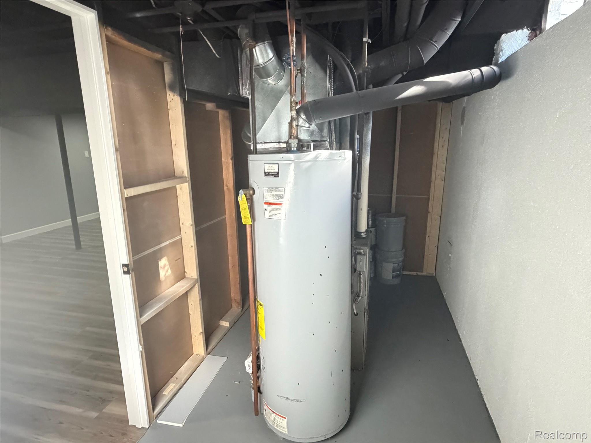 20698 Coachwood Road Riverview, MI 48193 - Photo 18 of 37 Utility room featuring gas water heater