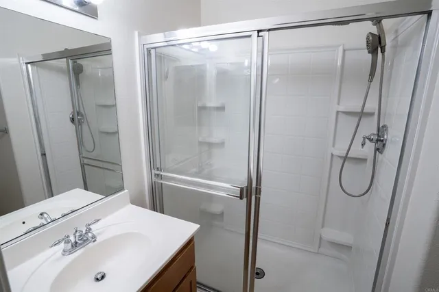 a bathroom with a sink and shower