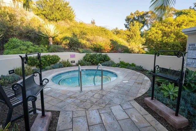 a view of a patio with table and chairs potted plants with wooden fence