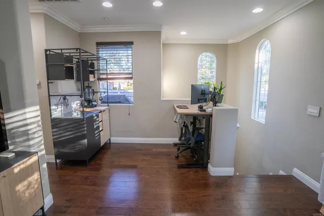 a view of a livingroom with furniture and a window