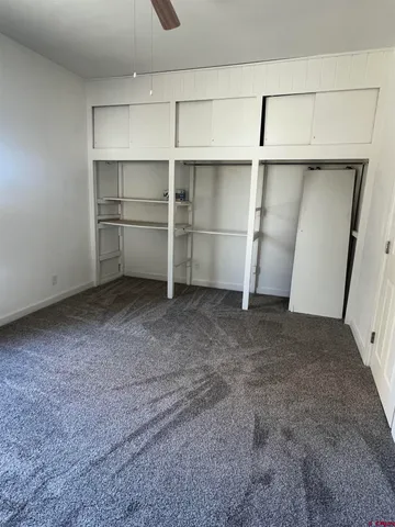 a view of an empty room with cabinet