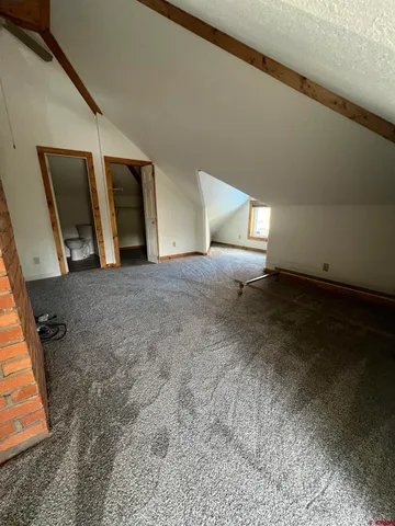 a view of an empty room with windows