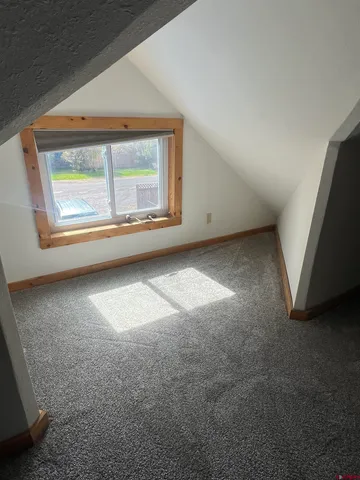 an empty room with a fireplace