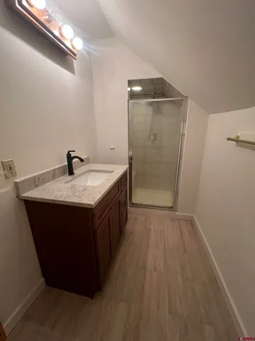 a kitchen with a sink and a mirror