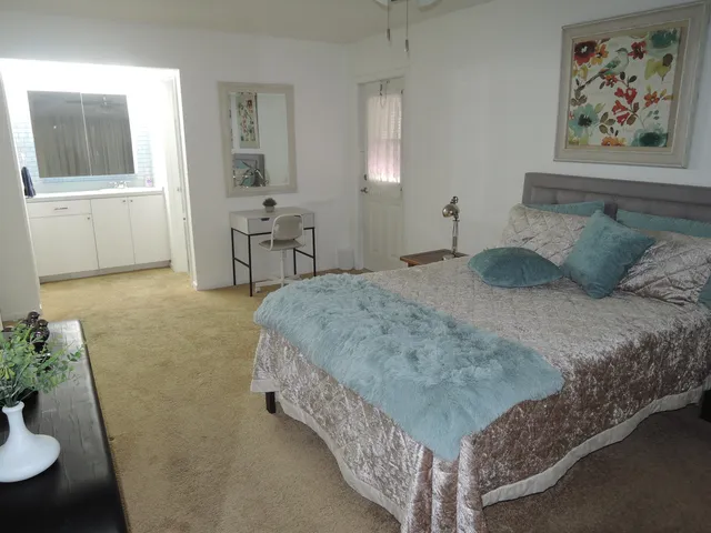 a bedroom with a bed and furniture