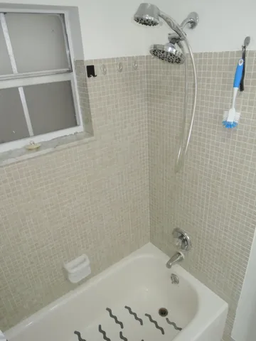 a bathroom with a sink and shower
